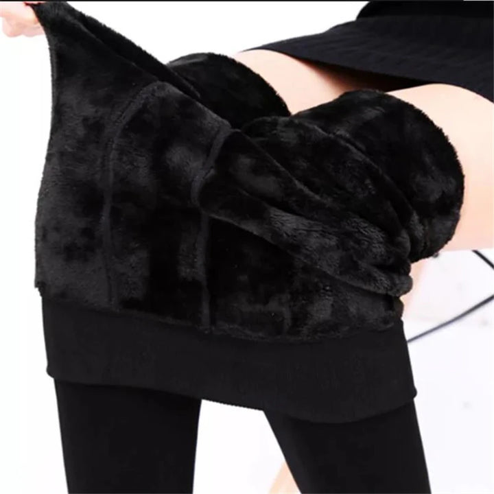 Women's Warm Velvet Tights, High Waist Leggings being adjusted for comfort and style.